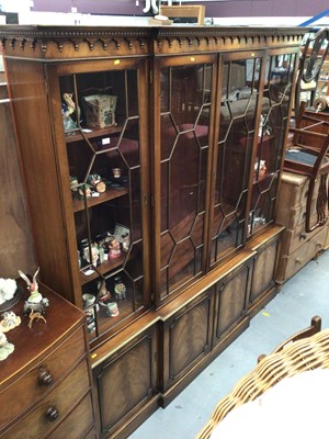 Lot 971 - Georgian-style mahogany breakfronted bookcase with astragal glazed doors above and panelled doors below , 204cm wide, 215 cm high
