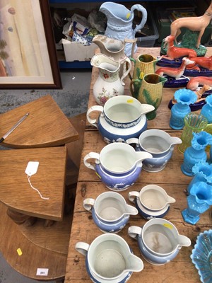 Lot 11 - Collection of Victorian pottery jugs, including seven graduated relief moulded jugs, two majolica sweetctorn jugs, and three more (12)