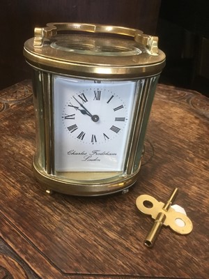 Lot 161 - Modern brass oval form carriage clock