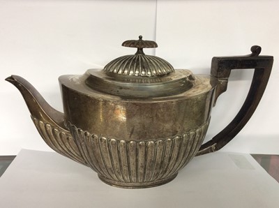 Lot 687 - Victorian silver teapot of half fluted form with angular ebony handle. Approx 20oz