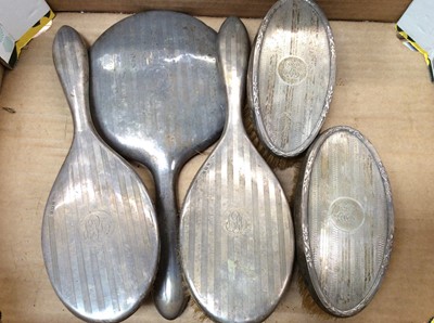 Lot 689 - Five silver backed dressing table bushes and hand mirror