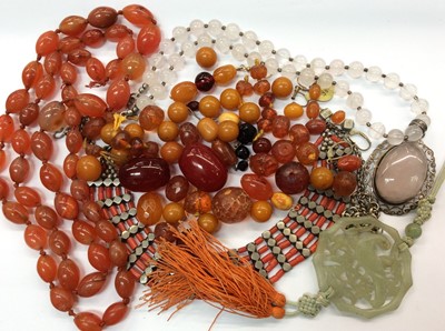 Lot 691 - Group costume jewellery including amber and simulated amber beads, carnelian necklace, quartz pendant necklace, carved green hardstone pendant, two ladies wristwatches, 19th century tortoise shell...