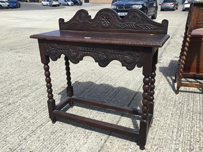 Lot 1007 - Victorian carved oak hall table on turned legs