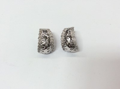 Lot 700 - Pair 18ct white gold diamond set screw back earrings
