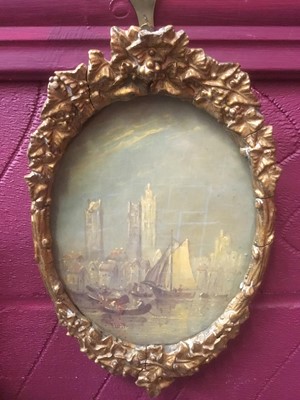 Lot 187 - Follower of Turner - 19th century oil depiction of Rouen, inscribed verso, oval, in glazed gilt frame