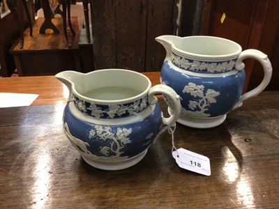 Lot 118 - Two 19th century relief moulded pottery jugs, decorated with hunting scenes, 10cm and 11.5cm high