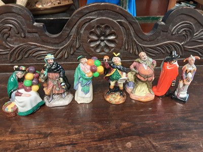 Lot 571 - Seven small Royal Doulton figures - The Jester HN3335, Guy Fawkes HN3271, Falslaff HN3236, Town Crier HN3261, The Balloon Seller HN 2130, Good King Wenceslas HN3262 and Old Baloon Seller HN2129 plu...
