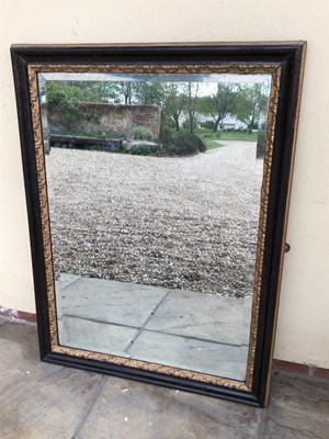 Lot 1043 - Late Victorian gilt and ebonised wall mirror with bevelled plate