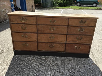 Lot 1063 - 19th century mahogany and pine nest of 12 drawers with brass swing handles 177 cm wide, 97 cm high, 46 cm deep