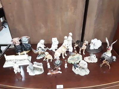 Lot 486 - Selection of porcelain ornaments including Coalport cottage, three Royal Doulton dogs, two Royal Worcester cats, etc plus a few Border Fine Arts models