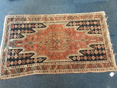 Lot 1069 - Three Eastern rugs 124cm x 75cm, 115cm x 71cm and 126cm x 74 cm