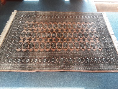 Lot 1073 - Eastern rug with geometric decoration, 187cm x 128cm