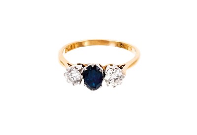 Lot 573 - 18ct gold sapphire and diamond three stone ring