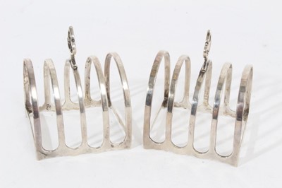 Lot 304 - Pair 1920s silver four division toast racks