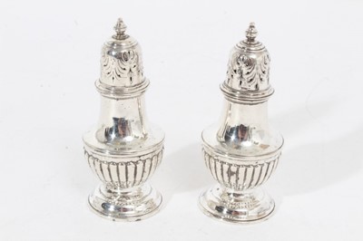 Lot 309 - Pair of Victorian silver pepper casters of baluster form