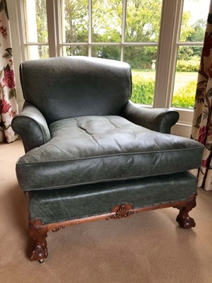 Lot 1415 - Good quality Howard & Sons low armchair, upholstered in blue/green leather with loose seat, on carved cabriole legs and claw and ball feet terminating on brass castors, the rear leg stamped 1238. 2...
