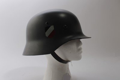 Lot 923 - Good quality reproduction Nazi German M35 pattern Wehrmacht helmet, complete with transfers, leather liner and chin strap.