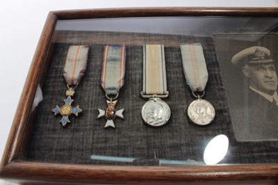 Lot 927 - Collection of seven miniature medals comprising C.B.E., M.V.O. First World War Victory medal, 1935 Silver Jubilee medal, Order of St Anislaus, Order of The Dannenburg
