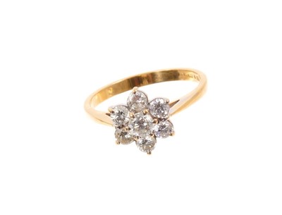 Lot 597 - Diamond cluster ring with a flower head cluster of seven brilliant cut diamonds in claw setting on 18ct yellow gold shank. Estimated total diamond weight approximately 0.54cts.