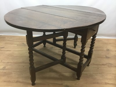 Lot 943 - 17th century oak drop leaf table