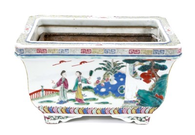 Lot 107 - Chinese famille rose porcelain jardiniere with tin liner, early 20th century, decorated with figural scenes with patterned borders, 24.25cm wide