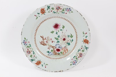 Lot 110 - 18th century Chinese famille rose porcelain dish, decorated with flowers and a fenced garden, 38.5cm diameter