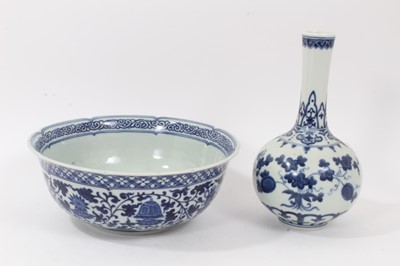 Lot 112 - Chinese blue and white vase and bowl, 20th century, both decorated with floral patterns and with seal marks, the vase measuring 20cm high