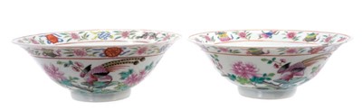 Lot 113 - Pair of Chinese famille rose porcelain bowls, c.1900, decorated with tropical birds, flowers and auspicious symbols, iron red seal marks to bases,  19cm diameter