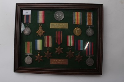 Lot 705 - First World War / Second World War Family medal group mounted in a glazed frame with a Jutland Commorative medallion, comprising 1914 - 15 Star named to S.S. 112052. R.E. Wheeler. STO. 1. R.N., War...