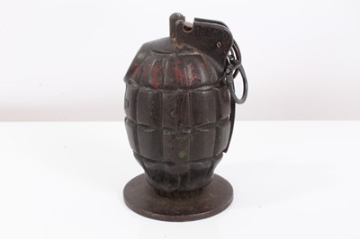 Lot 718 - Second World War British Army Deactivated Mills Bomb / Hand Grenade, mounted on circular plinth