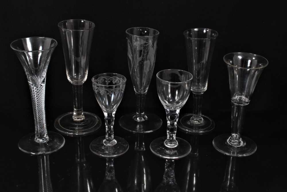 Lot 132 - Seven Georgian drinking glasses, including an air twist stem glass, three plain stem, two faceted stem  and one with an etched bowl, 12cm to 18.5cm high
