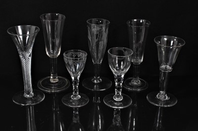Lot 132 - Seven Georgian drinking glasses, including an air twist stem glass, three plain stem, two faceted stem  and one with an etched bowl, 12cm to 18.5cm high