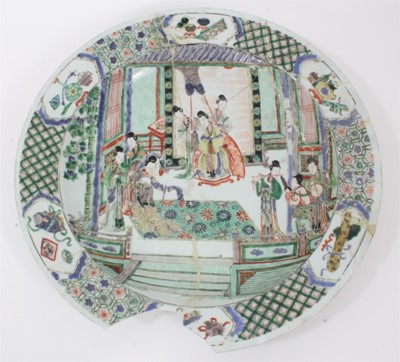 Lot 149 - Chinese Kangxi period famille verte dish, painted with an interior scene with figures and attendants, the border with panels of precious objects on a patterned ground, 37.5cm diameter 
Provenance:...