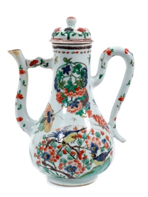 Lot 156 - Chinese famille verte porcelain ewer and cover, Kangxi period, painted with birds, flowers and insects, 21cm high