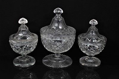 Lot 161 - Garniture of 19th century cut glass sweetmeat vases and covers, the larger example with slightly varying decoration, 19cm and 23cm high