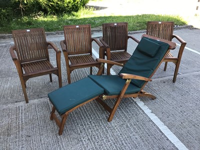 Lot 362 - Four teak garden chairs, together with a teak garden lounger and cushion