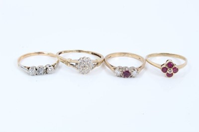 Lot 59 - Four gold diamond and ruby rings
