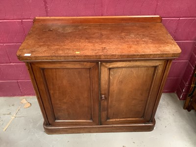 Lot 421 - Victorian mahogany secretaire cupboard with fitted pull-out secretaire drawer and four further drawers below enclosed by two panelled doors, retailed by Maple & Co, London