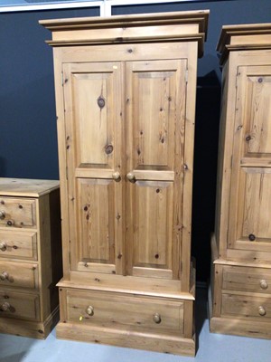 Lot 4 - Modern pine double wardrobe with two panelled doors and drawer below, 97.5cm wide x 63cm deep x 208.5 cm high