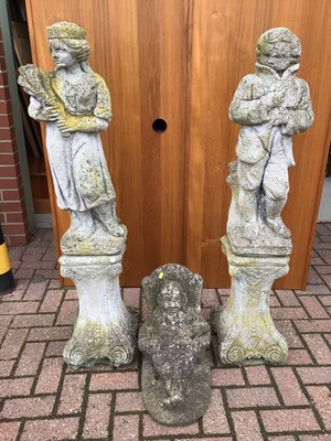 Lot 51 - Pair of concrete figures on stands 126cm and 123cm and one other of a seated gnome 40cm