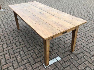 Lot 65 - Pine dining table on square legs 198cm wide x 88cm deep x 77cm high with a set of eight pine chapel chairs