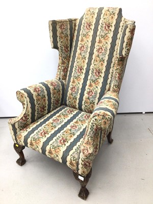Lot 39 - Good quality Georgian style wing back armchair with floral upholstery on carved mahogany legs with claw and ball feet