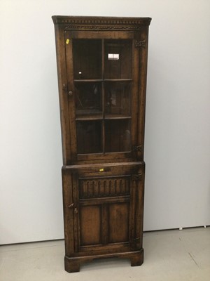 Lot 88 - Antique style oak two height corner cupboard with glazed door above and panel door below 61cm wide x 179cm high