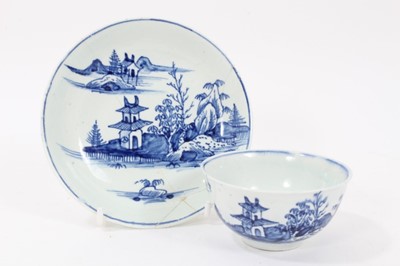 Lot 177 - Vauxhall blue and white tea bowl and saucer, c.1755, decorated with an Oriental island pattern, the saucer measuring 12cm diameter