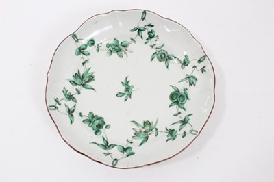 Lot 178 - Bristol saucer dish, circa 1775, decorated with floral swags in green monochrome, the scalloped rim painted, B mark to base, 18.5cm diameter