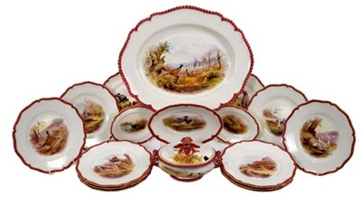Lot 179 - Fine quality Royal Worcester sporting service, painted with various British birds, with maroon and gilt patterned rims, to include a platter, tureen and stand, two small serving dishes and twelve p...
