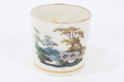 Lot 183 - Pinxton coffee can, c.1800, polychrome painted with a landscape scene, with gilt banding, 6.25cm high