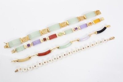 Lot 92 - Four gold mounted hard stone bracelets
