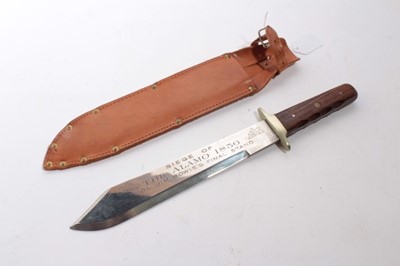 Lot 874 - American Bowie Knife with polished steel blade, etched "Siege of the Alamo 1836, Col. Jim Bowie's Final Stand", with wooden grip, in brown leather sheath.