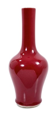 Lot 186 - Chinese sang-de-boeuf glazed bottle vase, Kangxi mark to base but 19th/20th century, 24.5cm high